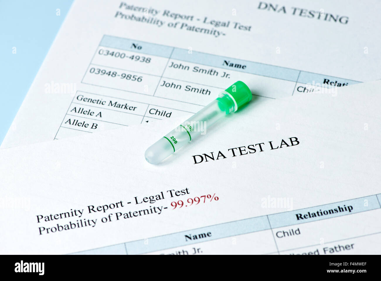 Paternity test results report with lab sample test tube. Stock Photo