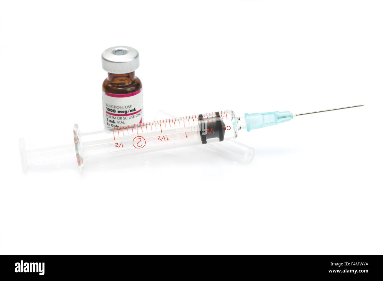Syringe and vaccine vial on white background. Stock Photo