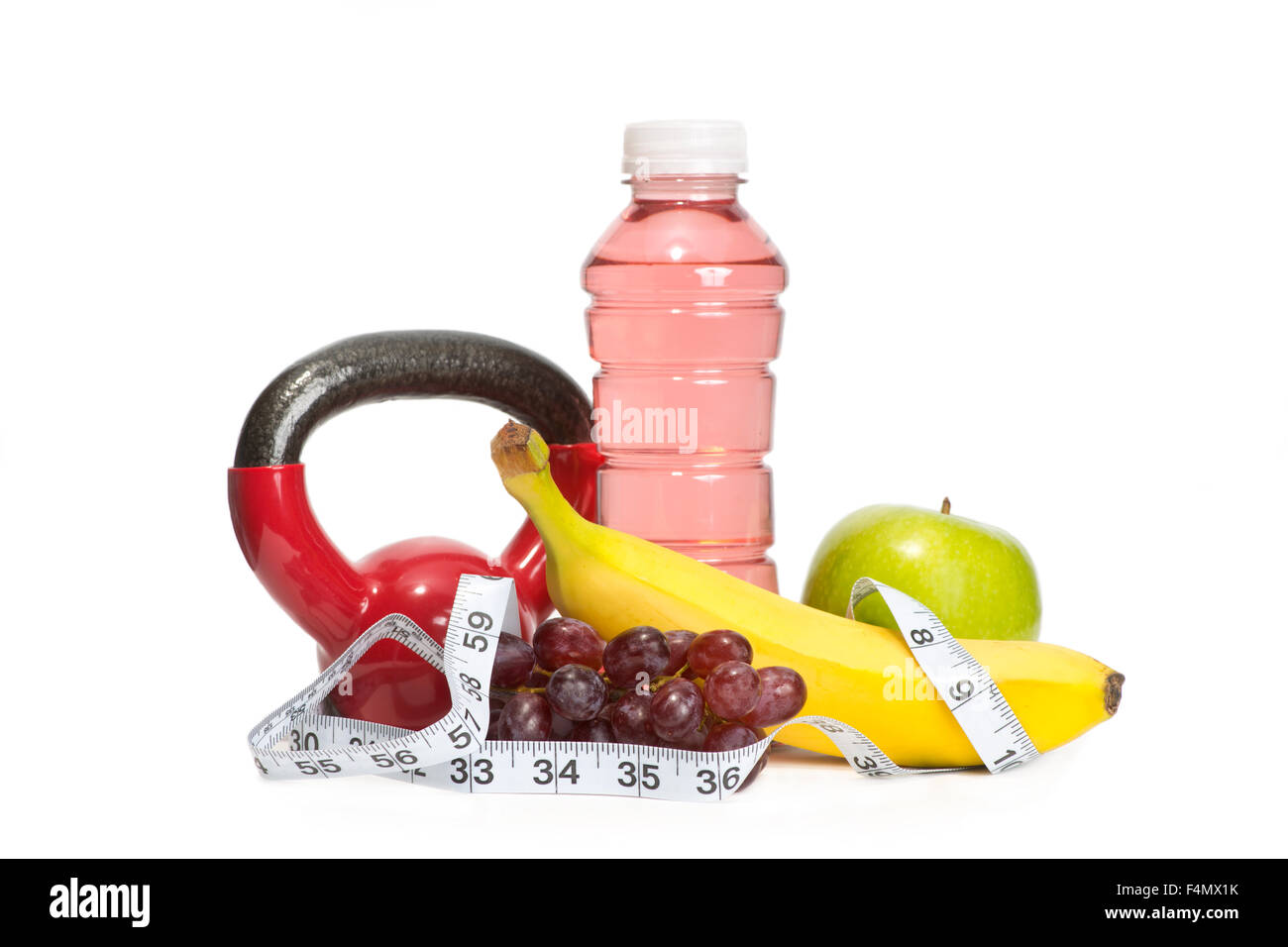 Red workout weight with sports drink, fruit, and tape measure to illustrate women's fitness