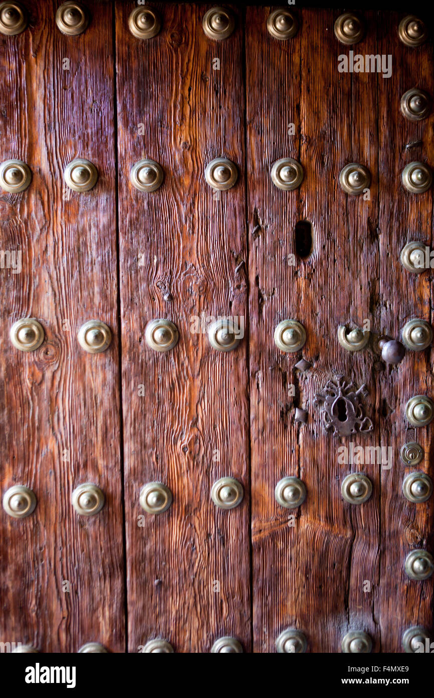 Beautiful old wooden door with iron ornaments. Casar de Caceres, Spain Stock Photo