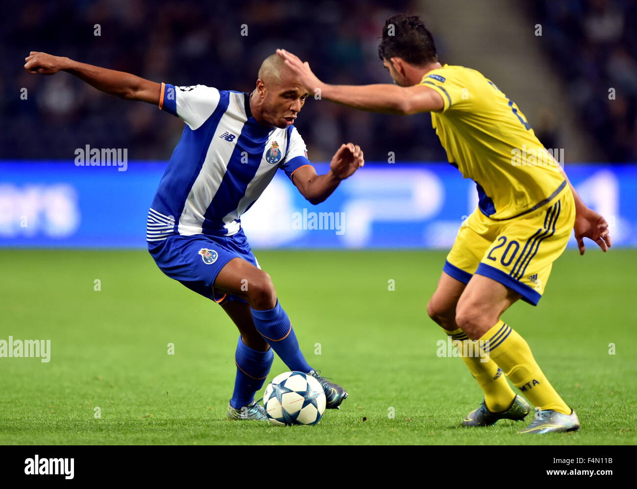 Porto, Portugal. 20th Oct, 2015. Yacine Brahimi (L) of Porto vies with a player of Maccabi Tel-Avivin during the UEFA Champions League group G football match, in Porto, Portugal, Oct. 20, 2015. Porto won 2-0. Credit:  Zhang Liyun/Xinhua/Alamy Live News Stock Photo
