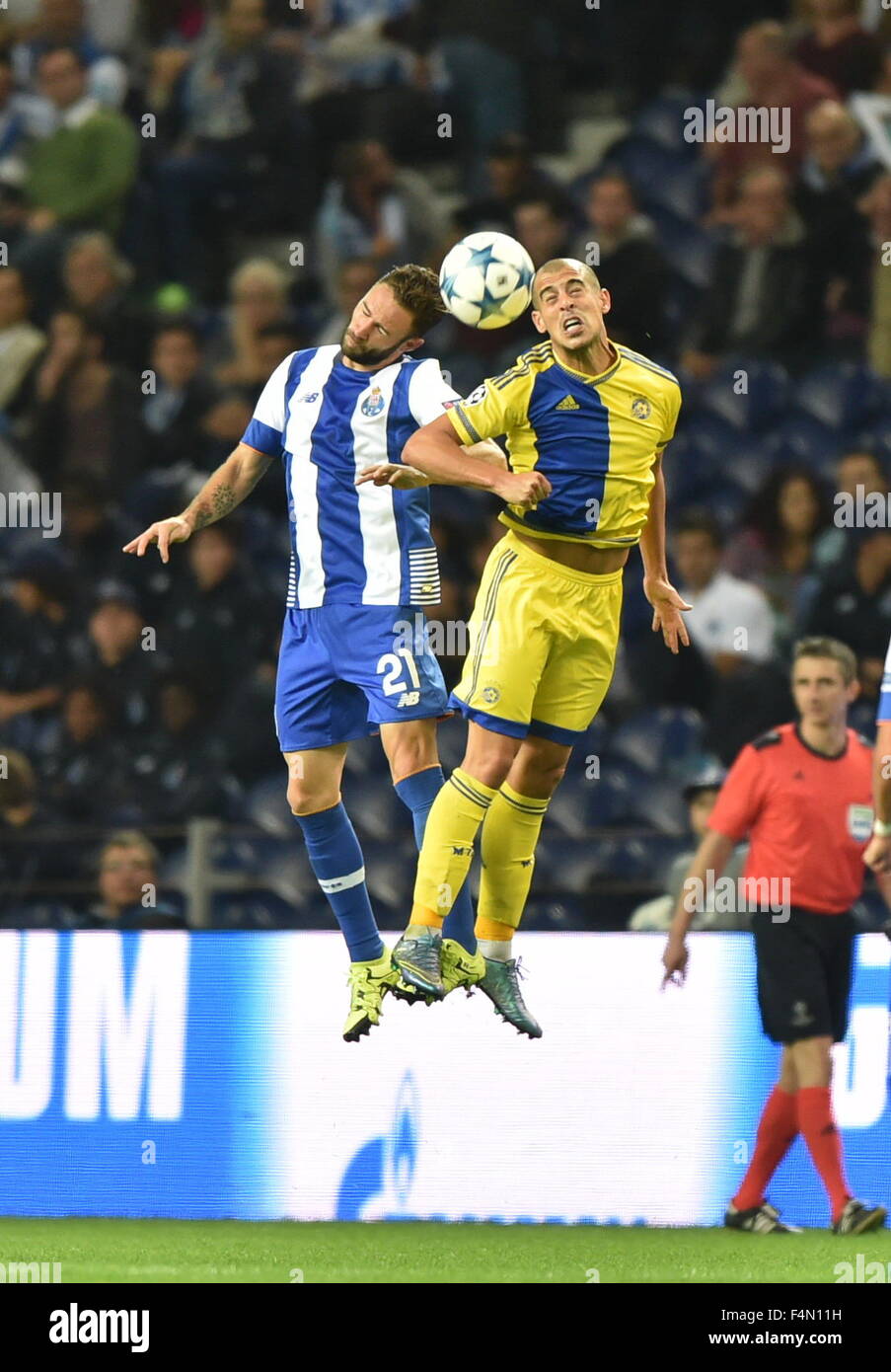 Porto, Portugal. 20th Oct, 2015. Miguel Layun (L) of Porto vies with a player of Maccabi Tel-Avivin Porto during the UEFA Champions League group G football match, in Porto, Portugal, Oct. 20, 2015. Porto won 2-0. Credit:  Zhang Liyun/Xinhua/Alamy Live News Stock Photo