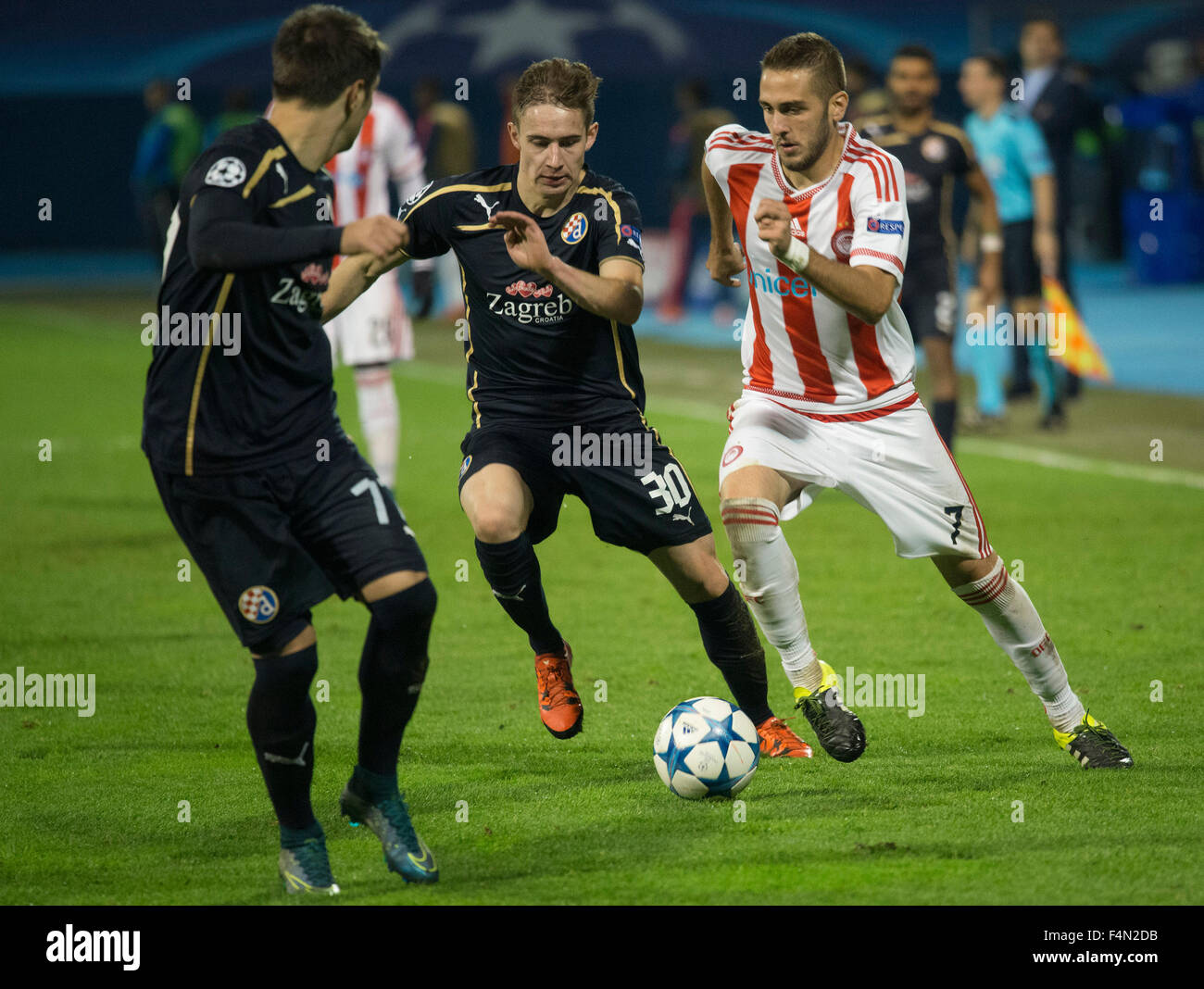 Zagreb, Croatia. 20th Oct, 2015. Kostas Fortounis (R) of Olympiacos vies  with players of Dinamo Zagreb during the UEFA Champions League Group F  football match at Maksimir stadium in Zagreb, Croatia, on