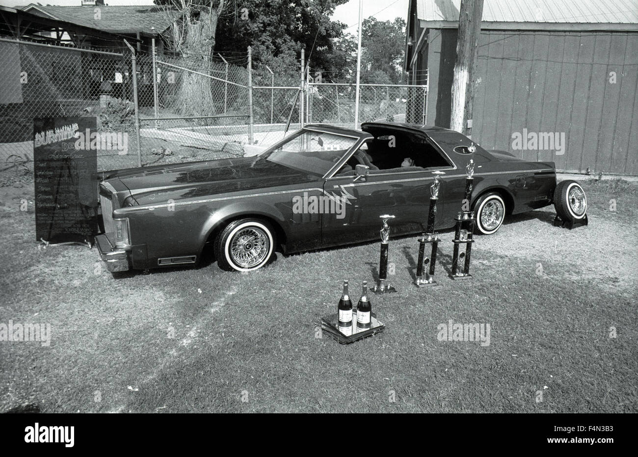 Lowrider parked with trophies during custom car show at the Porterville