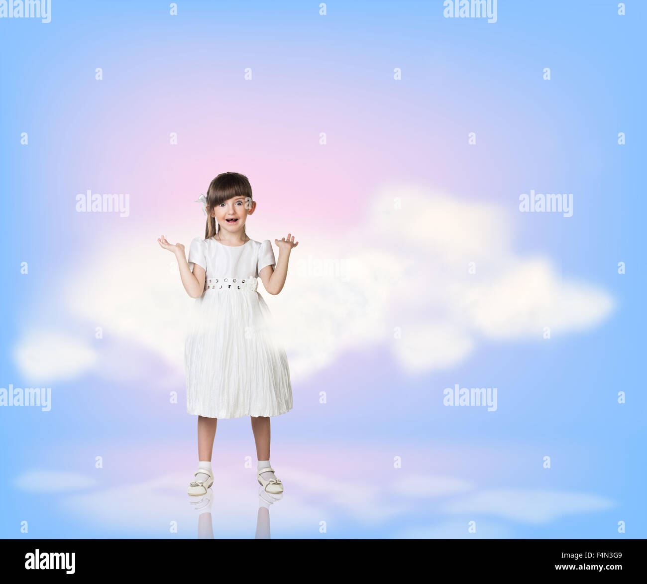 Little girl in sky clouds Stock Photo