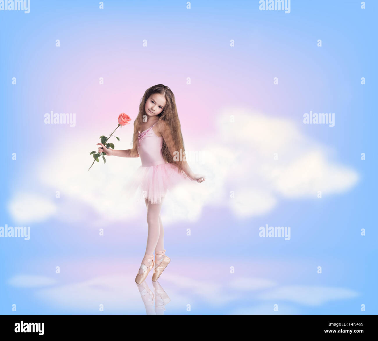 Little girl in sky clouds Stock Photo - Alamy