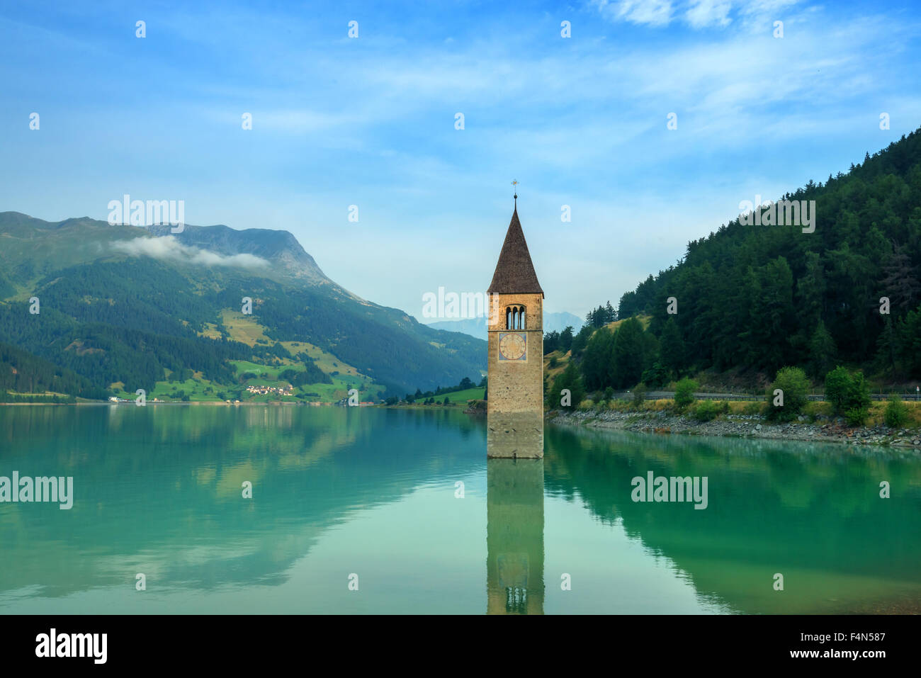 Beautiful view of the lake Resia. Famous tower in the water. Alps, Italy, Europe. Stock Photo