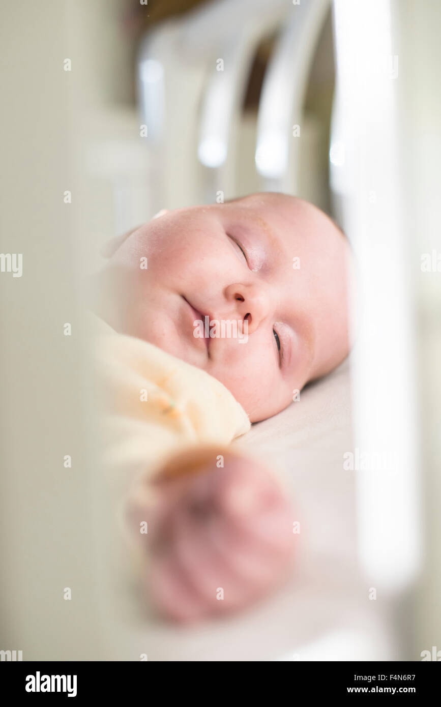 Portrait of sleeping baby girl in a cot Stock Photo Alamy