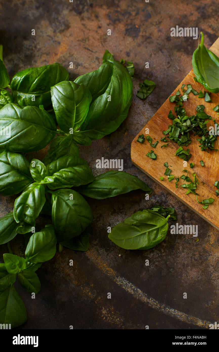 Whole and chopped basil leaves Stock Photo Alamy