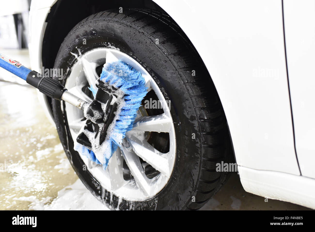 Car cleaning, cleaning the alloy wheel Stock Photo Alamy