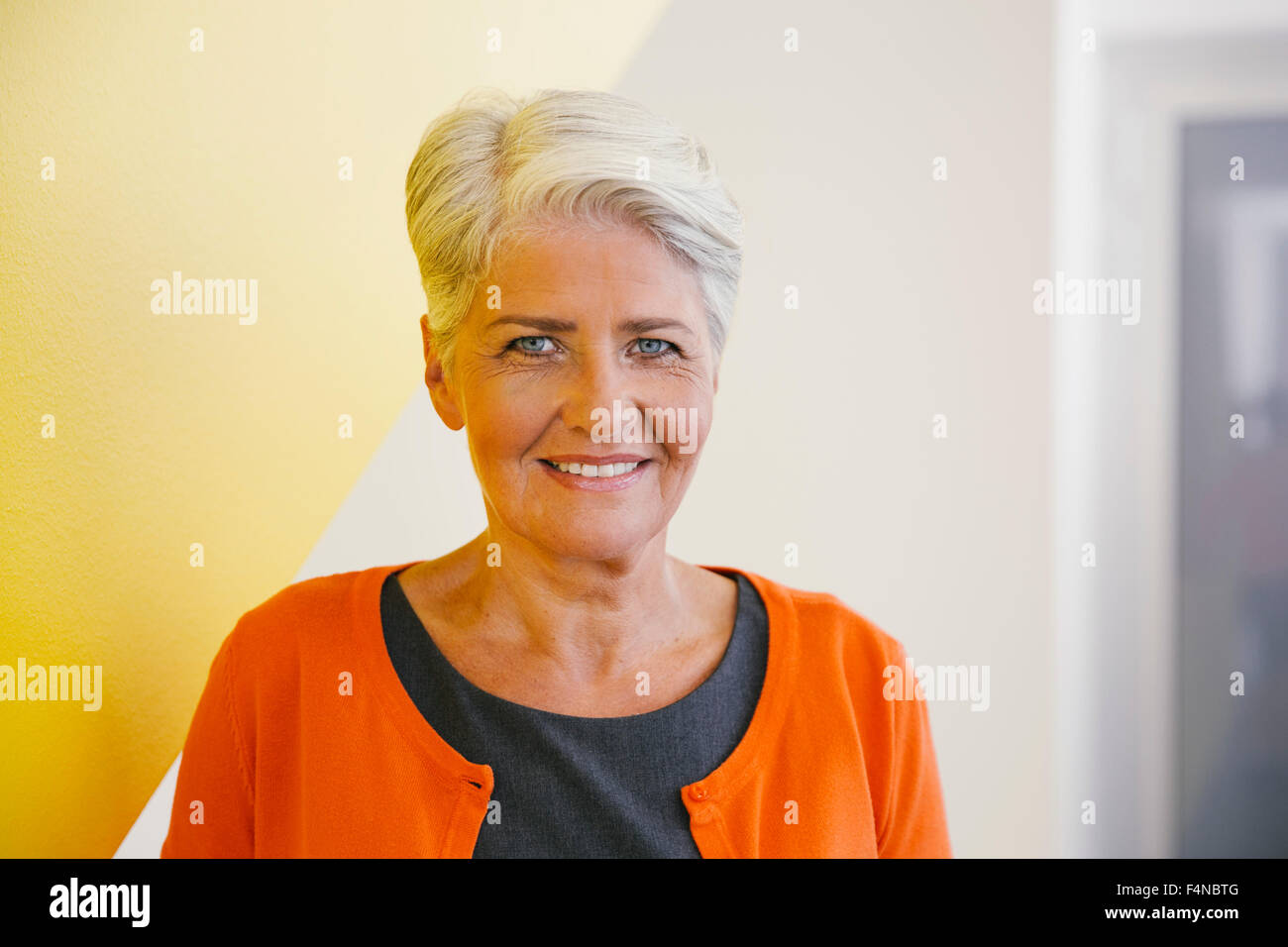 Portrait of smiling mature woman with short grey hair Stock Photo - Alamy