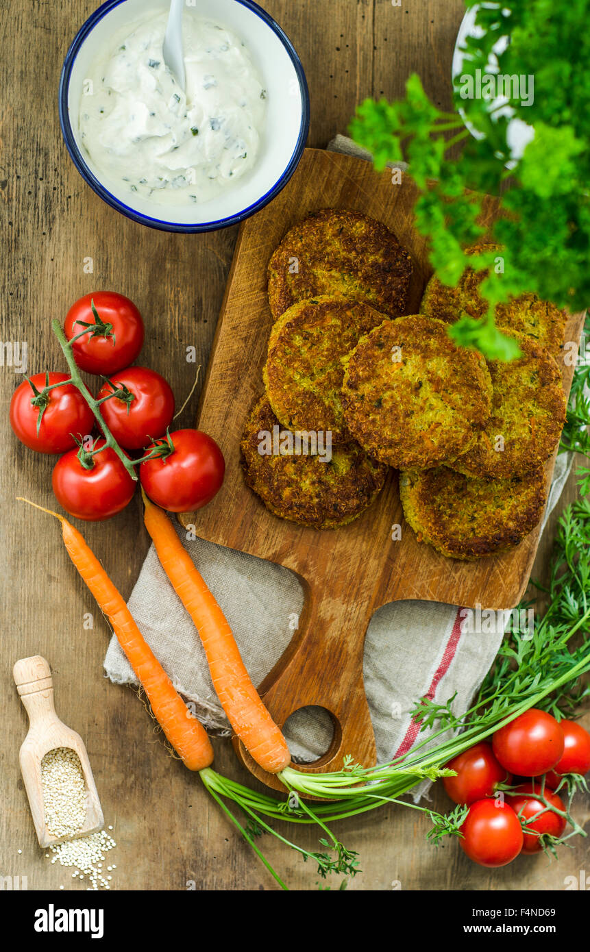 Quinoa fritters and bowl of herbed curd cheese Stock Photo Alamy