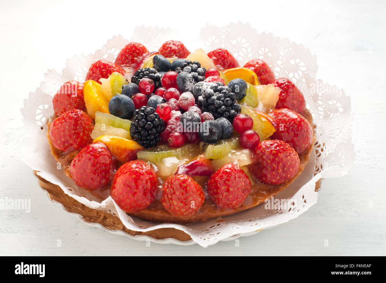 Cake with lots of fresh fruit : strawberries , kiwi , melon , berries Stock Photo