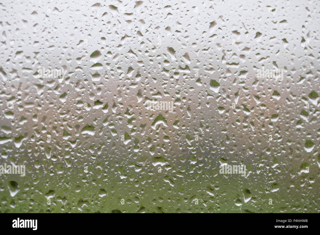 Glass surface with water drops in a rainy day Stock Photo - Alamy