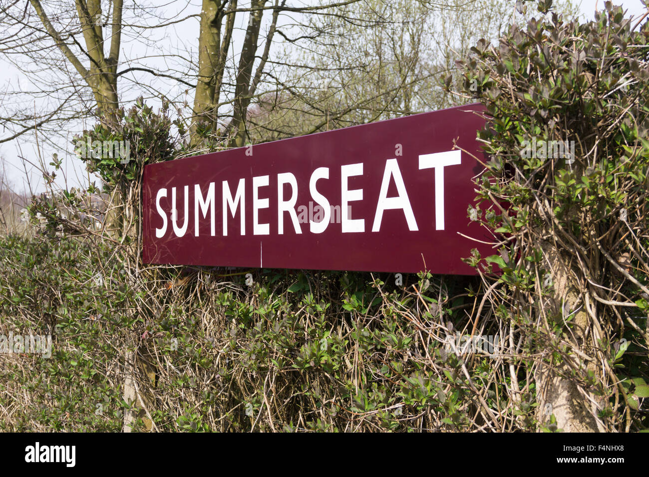Railway station sign (British Railways style) at Summerseat, a countryside station on the heritage East Lancashire Railway. Stock Photo
