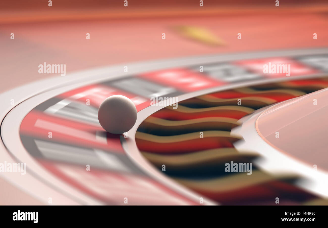 Playing roulette in the casino. Motion blur on the wheel and numbers. Depth of field with focus on the ball. Stock Photo