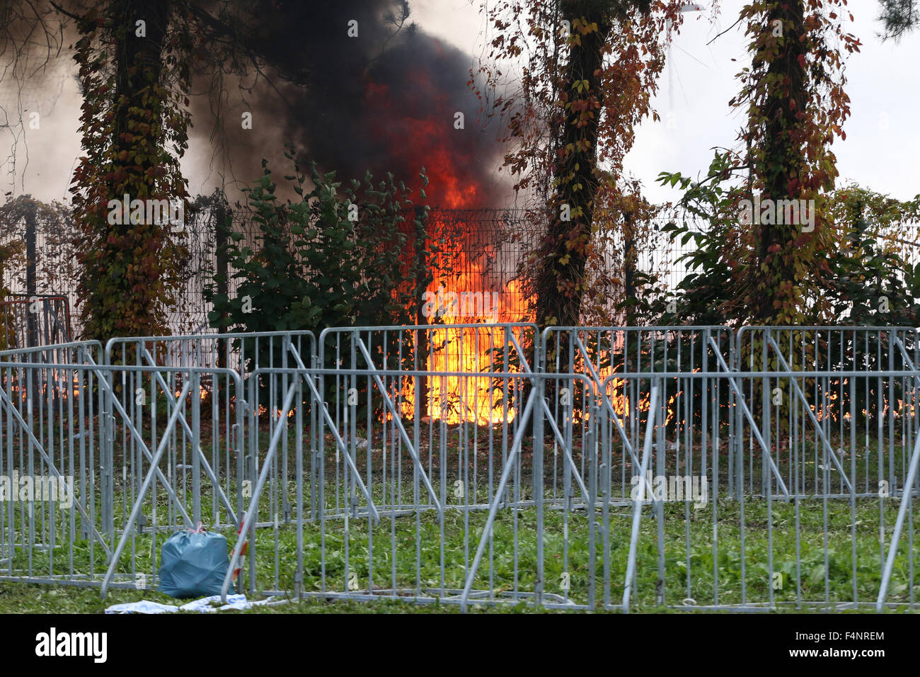 Brezice, Slovenia. 21st Oct, 2015. Slovenia is coping with the large influx of refugees from Siria, Afganistan, Iraq,... On the border with Croatia, in small town Brežice, camp was build to register and transfer refugees. Becouse they weren't happy with situation the set afire the tents. Firefighters were able to put out the fire and police to calm the situation, but almost half of the tens burned out. Credit:  Mitja Mladkovic/Alamy Live News Stock Photo