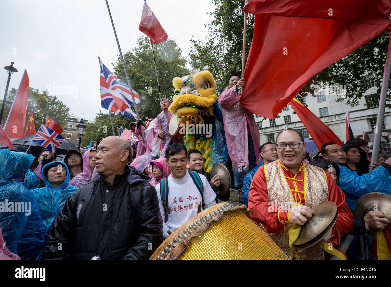 London, UK. 21st October, 2015. Pro-Chinese government supporters wait for President Xi Jinping to arrive at Downing Street on day two of his official state visit in UK Credit:  Guy Corbishley/Alamy Live News Stock Photo