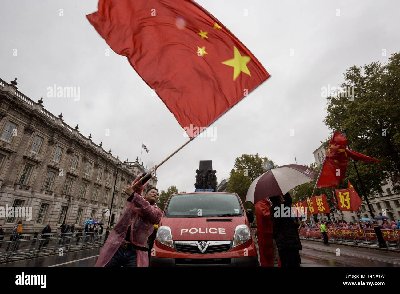 London, UK. 21st October, 2015. Pro-Chinese government supporters wait for President Xi Jinping to arrive at Downing Street on day two of his official state visit in UK Credit:  Guy Corbishley/Alamy Live News Stock Photo