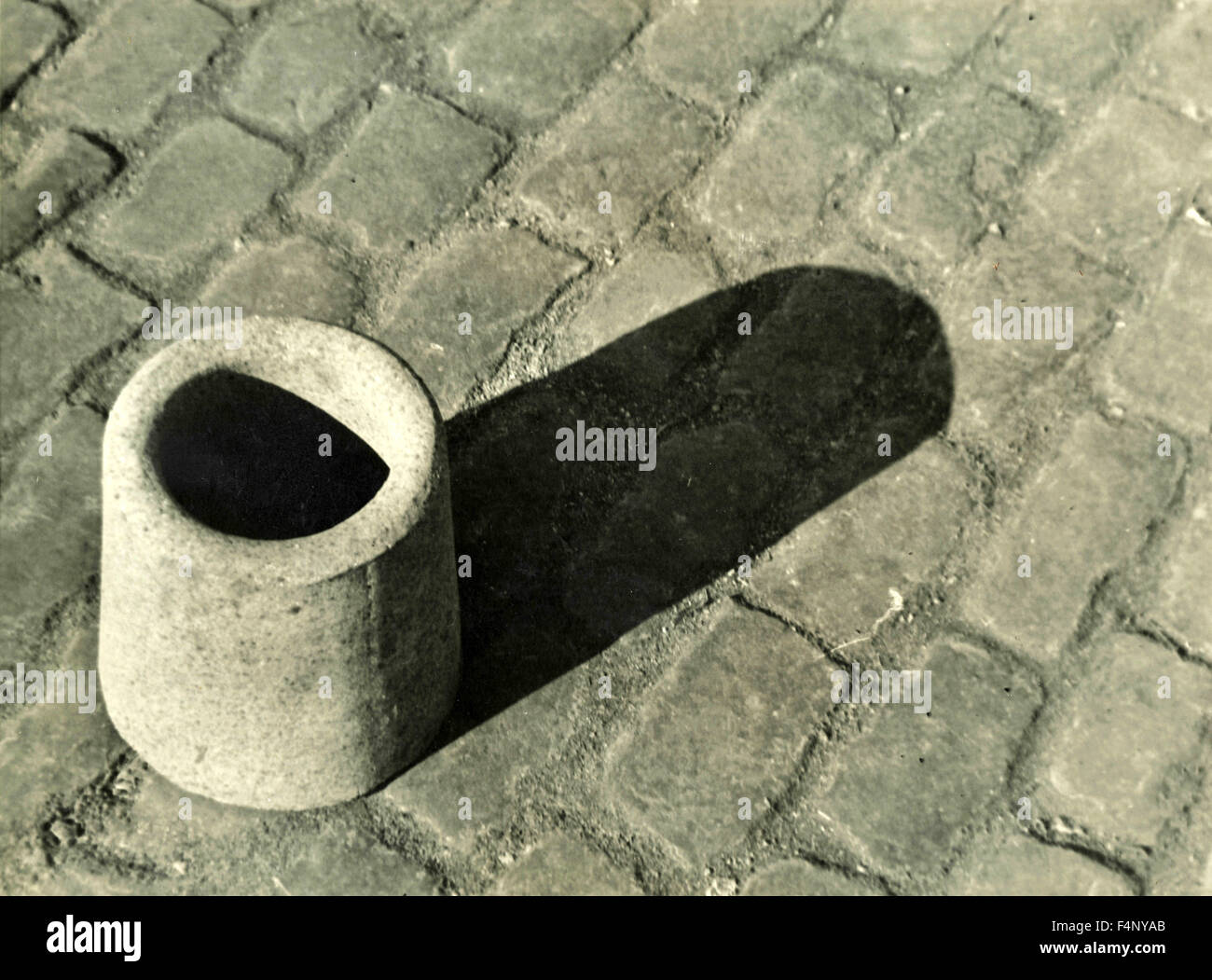 A short concrete pipe resting on the road Stock Photo