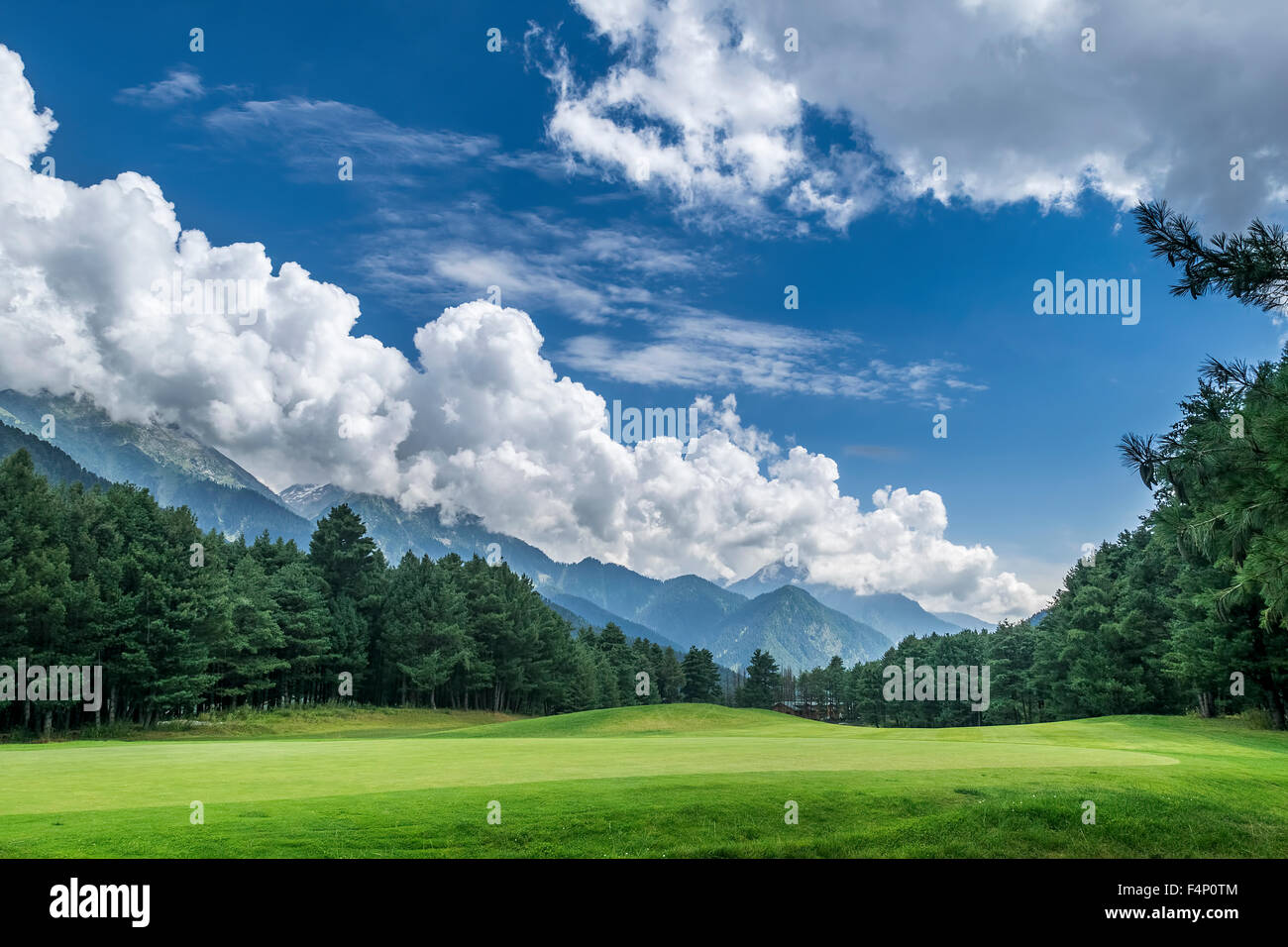 Pahalgam Golf Course with mountains in background, Jammu and Kashmir, India Stock Photo