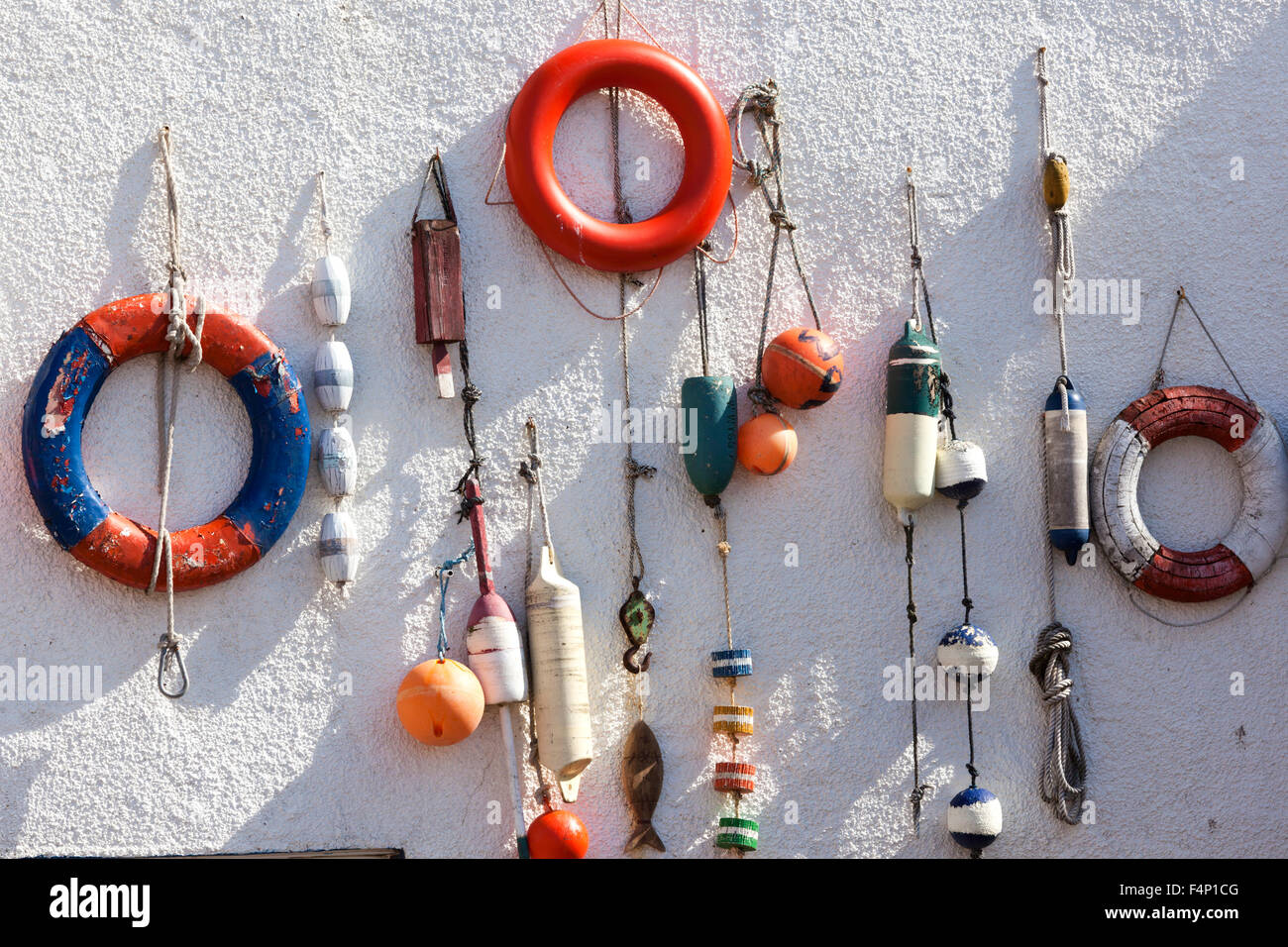 Boating odds and ends on a cottage wall at Lower Largo, East Neuk of Fife, Scotland UK Stock Photo