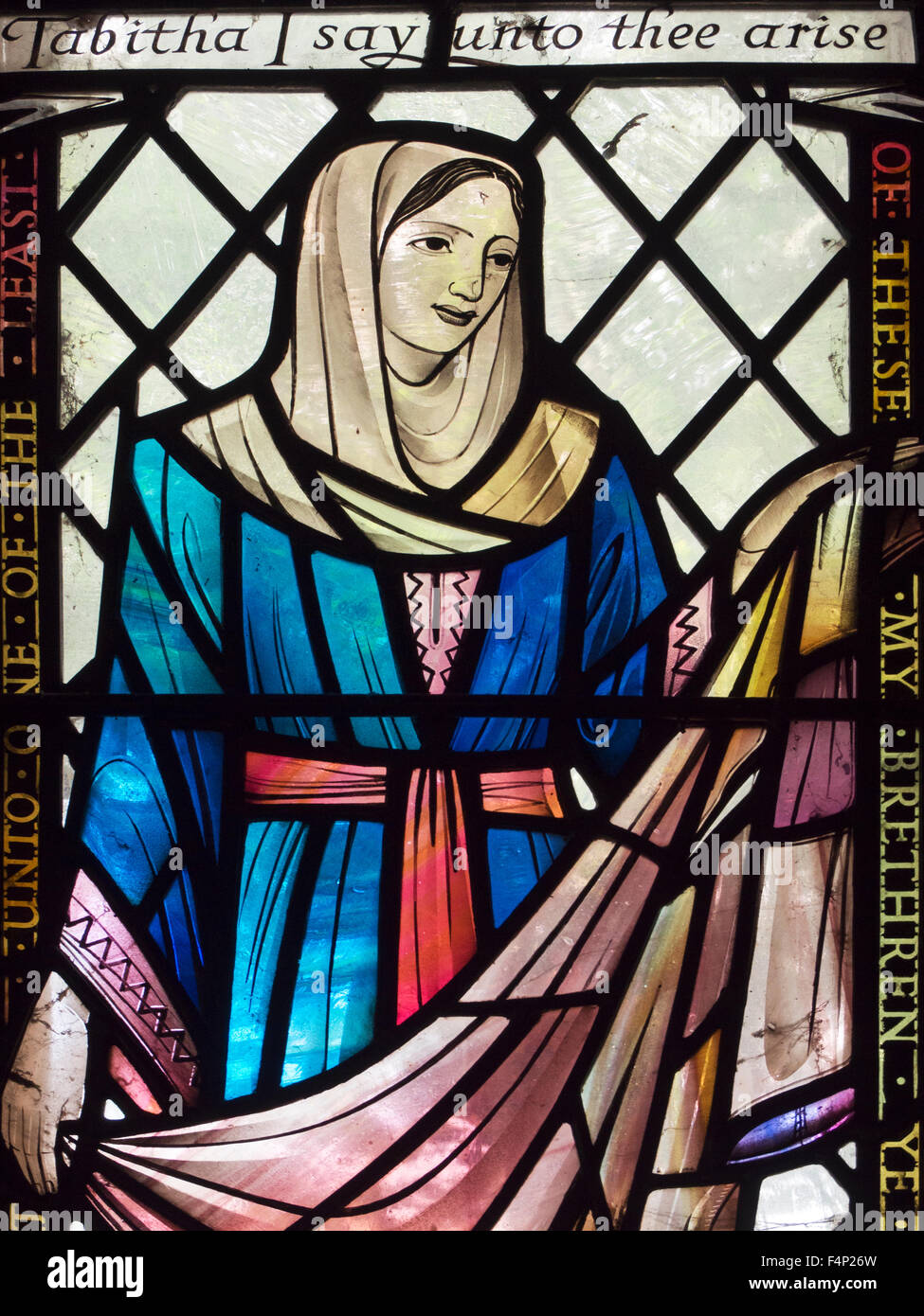 Tabitha I Say Unto Thee Arise Stained Glass Window at St Ebbas Church in Beadnell Northumberland England Stock Photo