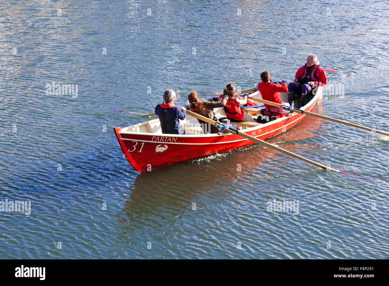 Crail Rowing Club in their coastal skiff Partan from the harbour in the small fishing village of Crail, Fife, Scotland UK Stock Photo