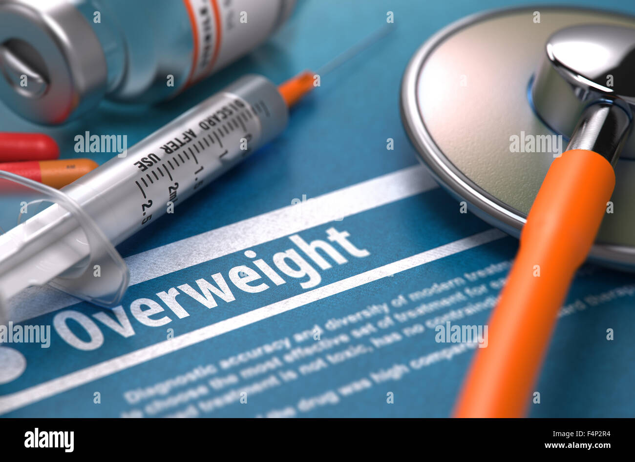 Diagnosis - Overweight. Medical Concept with Blurred Text, Stethoscope, Pills and Syringe on Blue Background. Selective Focus. Stock Photo