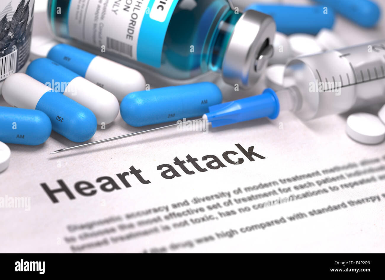 Heart Attack - Printed Diagnosis with Blurred Text. On Background of Medicaments Composition - Blue Pills, Injections and Syring Stock Photo