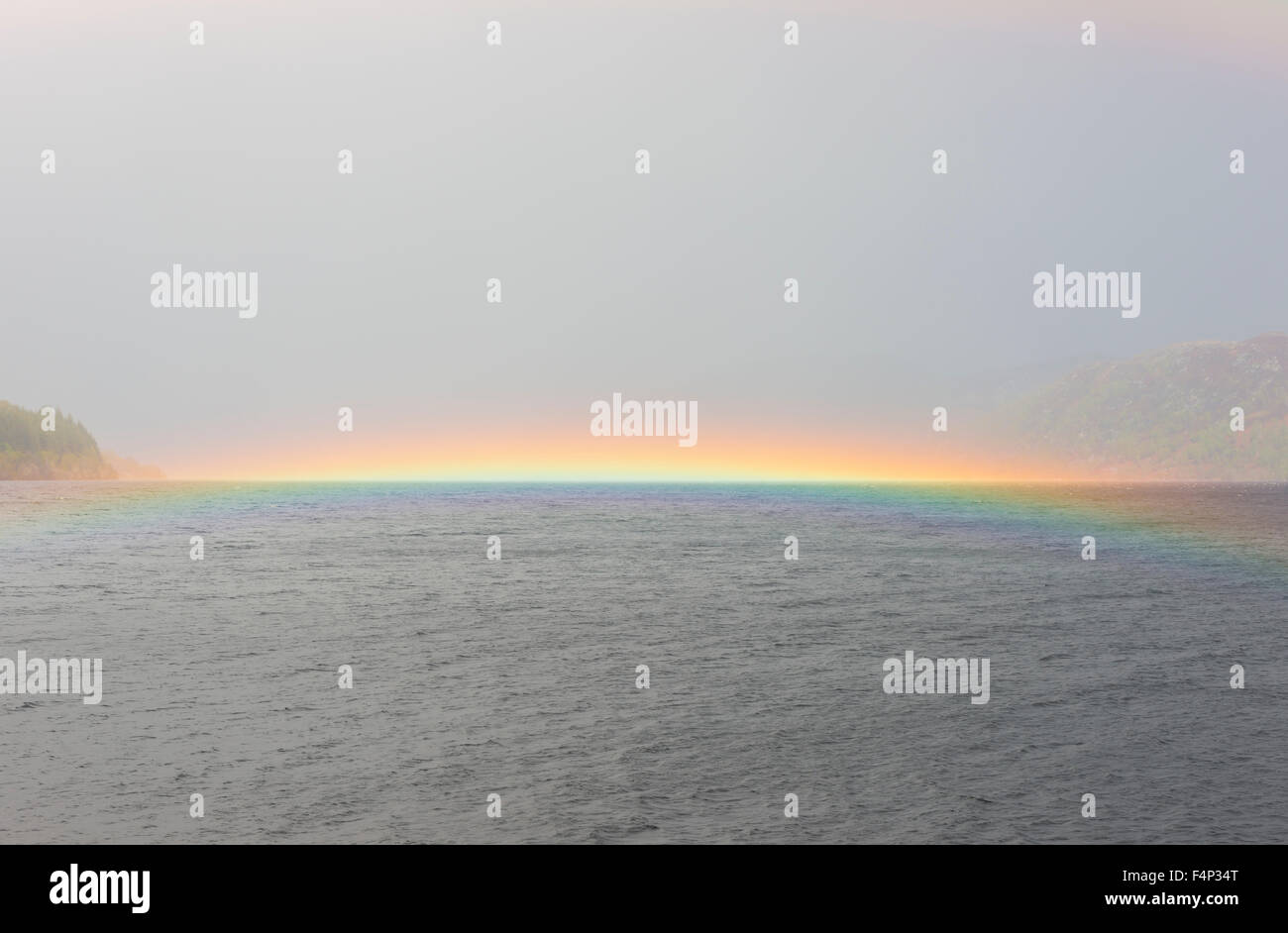 Rainbow on water on Loch Ness in Scotland Stock Photo