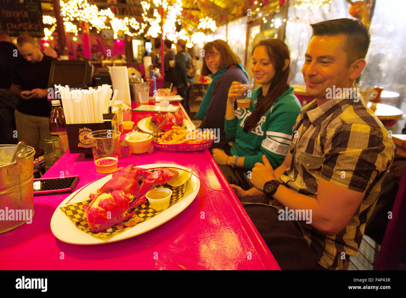 People eating lobster meal, The Barking Crab restaurant, Boston Massachusetts New England, USA Stock Photo