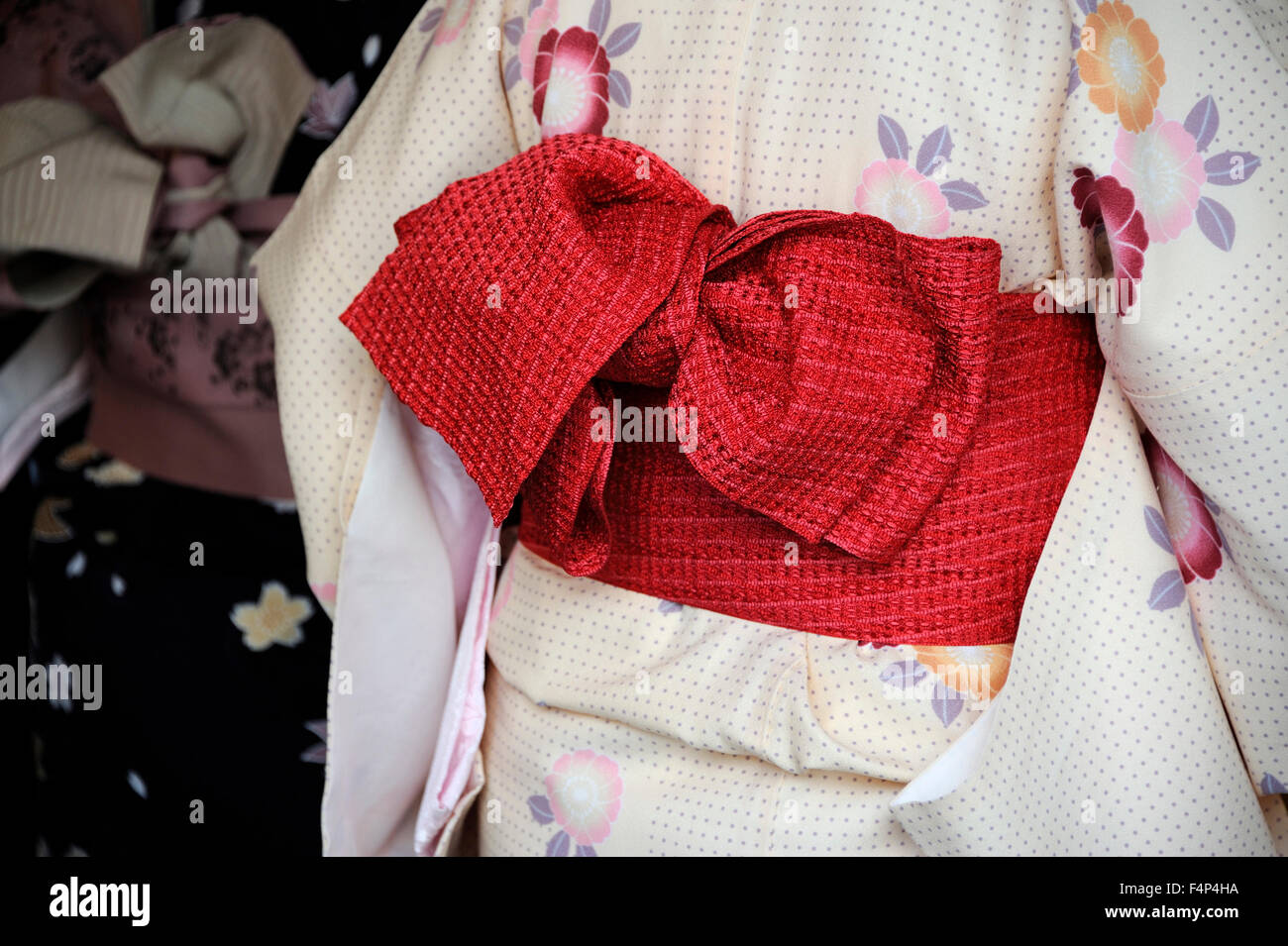 Geisha wearing kimono.This is a traditional Japanese dress. Kyoto is also known as the capital