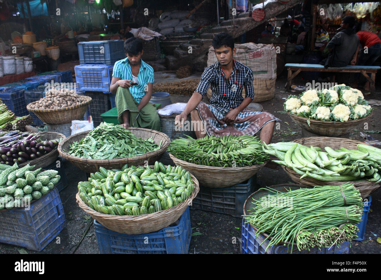 Bangladeshi vegetable vendors wait for customer at Karwan Bazar kitchen