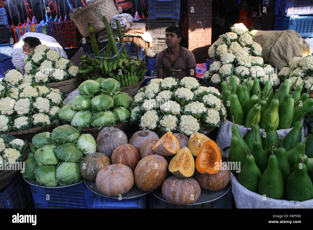 Bangladeshi vegetable vendors wait for customer at Karwan Bazar kitchen