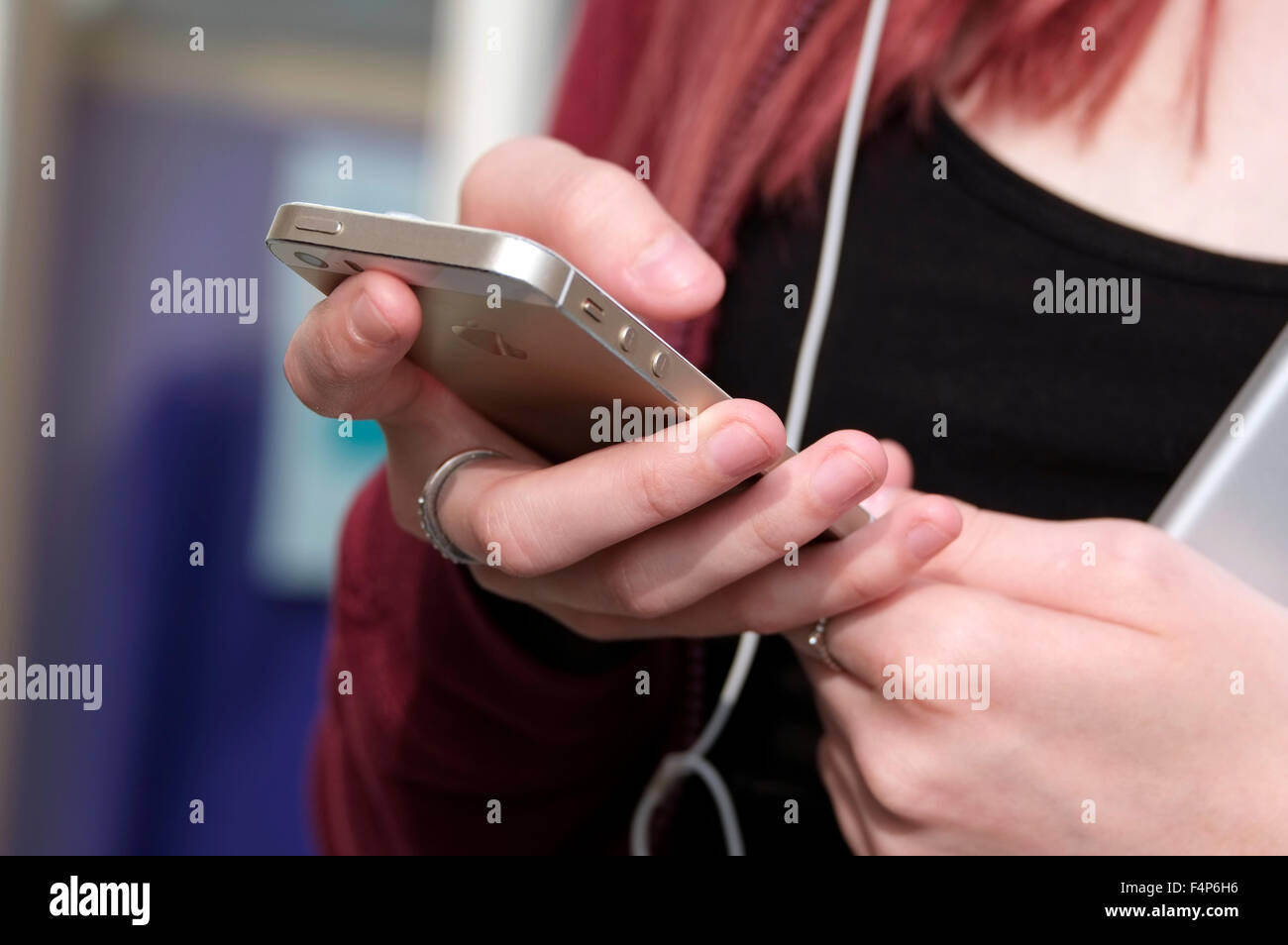 young female teenager using mobile phone Stock Photo