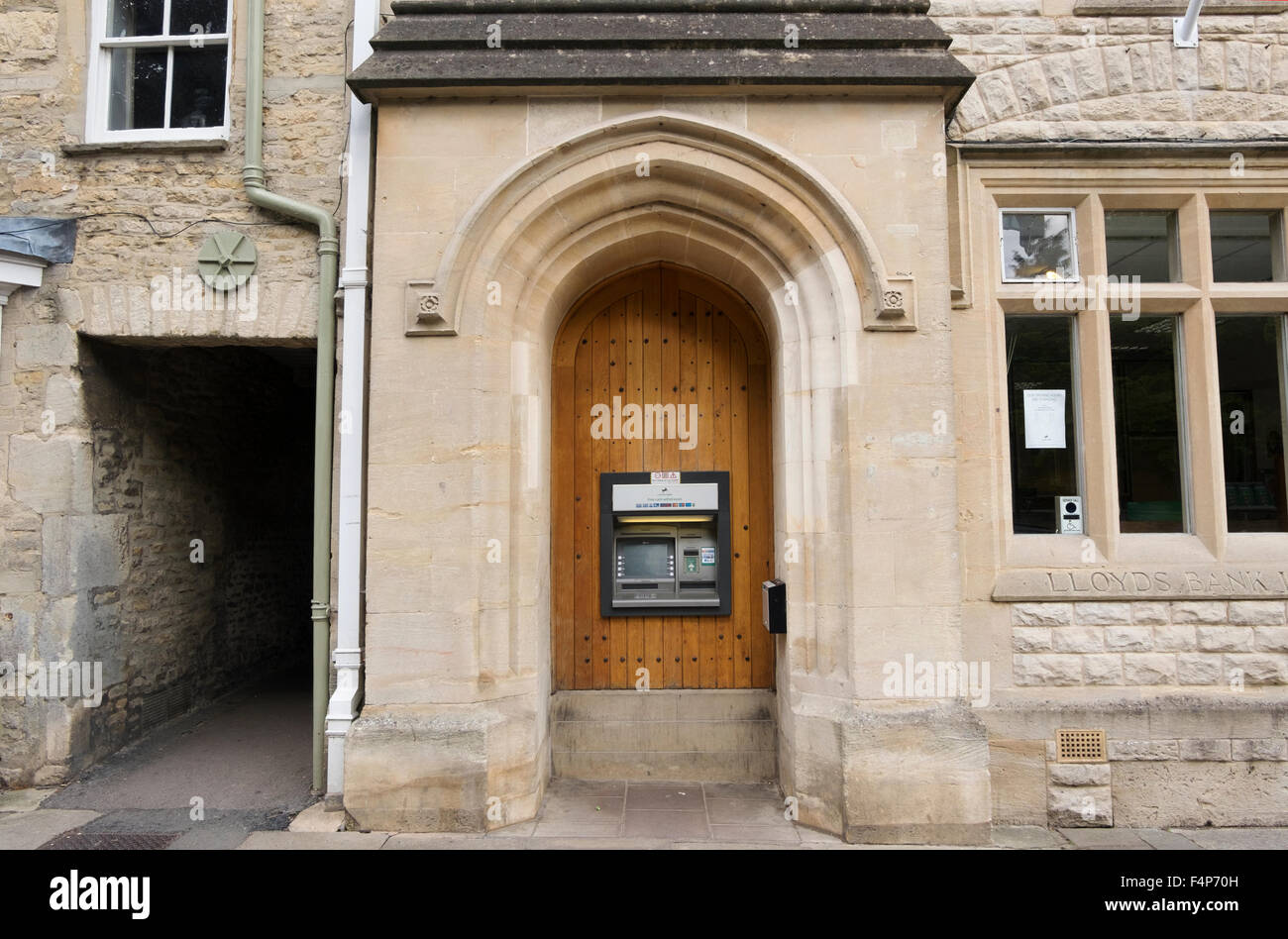 Cash Point at the local branch of Lloyds Bank in the High Street in Fairford, Gloucestershire, UK Stock Photo