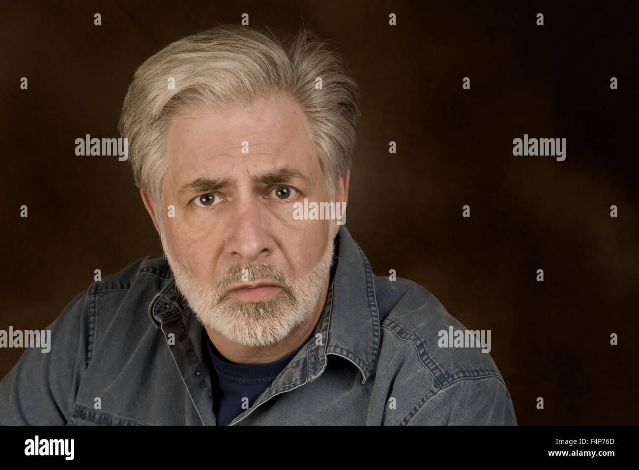 A middle aged man showing signs of Anxiety, Fear or Depression Stock Photo