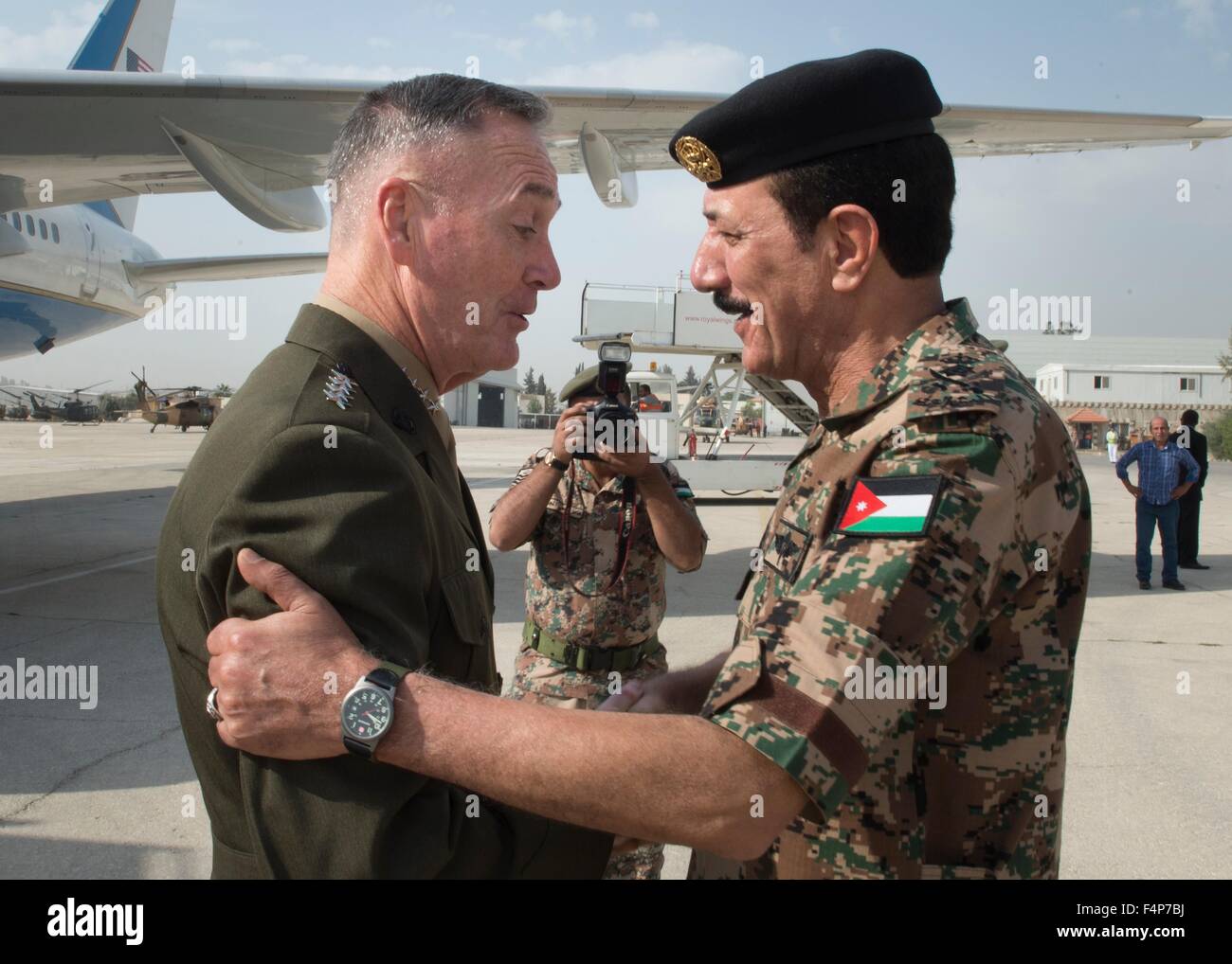 U.S. Chairman of the Joint Chiefs Gen. Joseph Dunford Jr. is welcomed by Jordanian Chief of Defense, Gen. Meshal Al Zaben on arrival October 19, 2015 in Amman, Jordan. Stock Photo