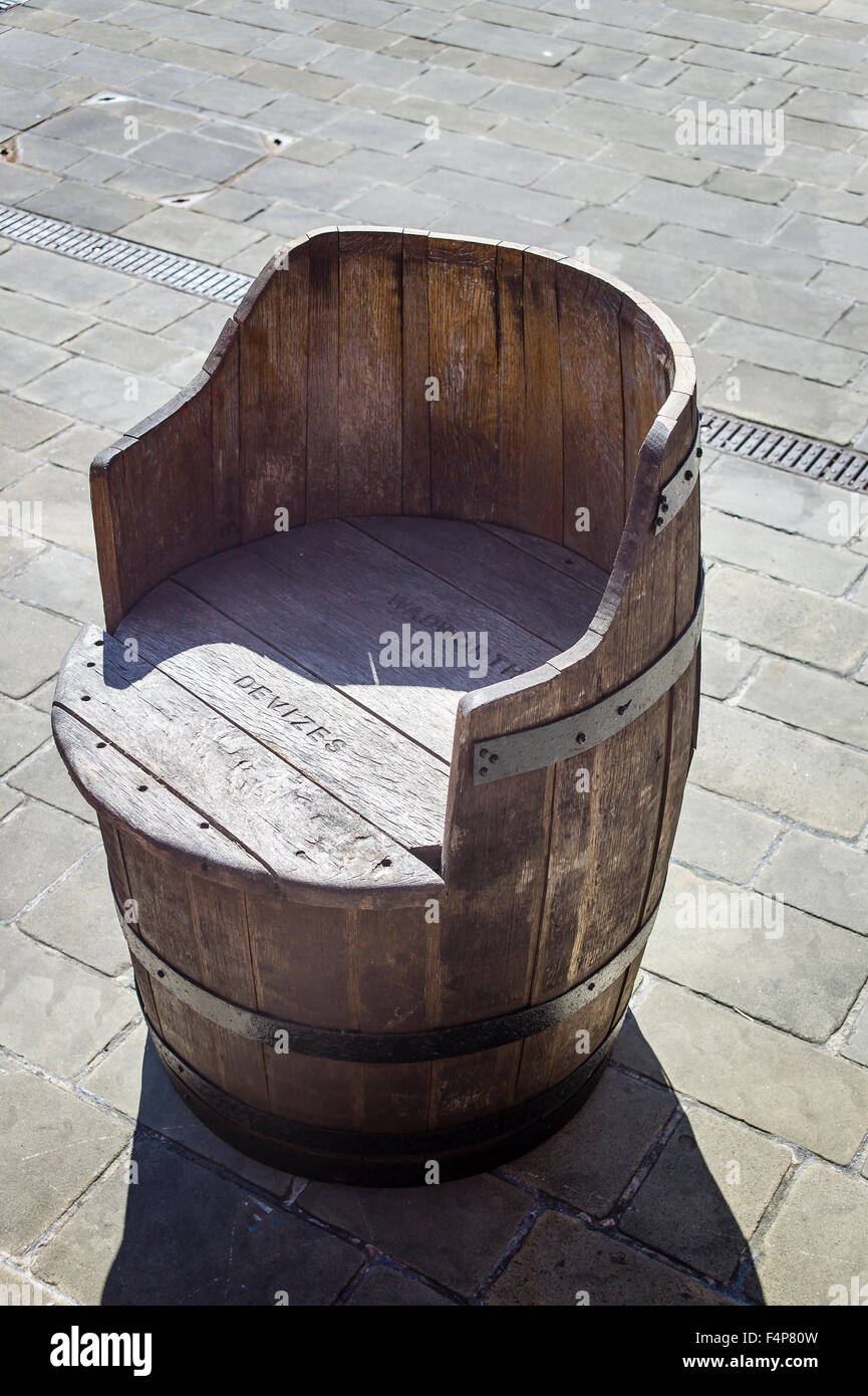 Old Wadworth beer barrel converted into a seat Stock Photo