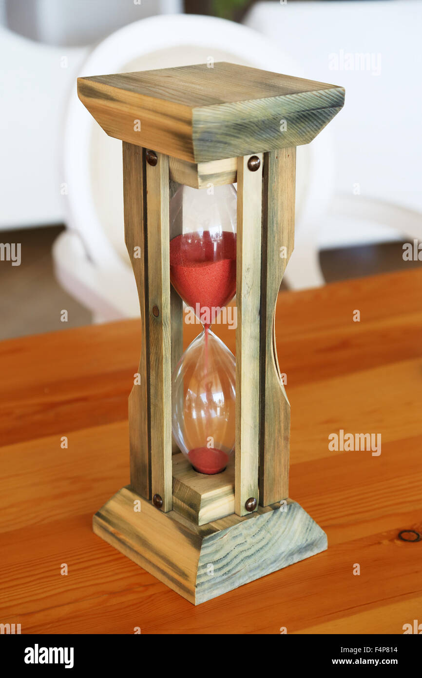 hourglass on the table, vertical image Stock Photo