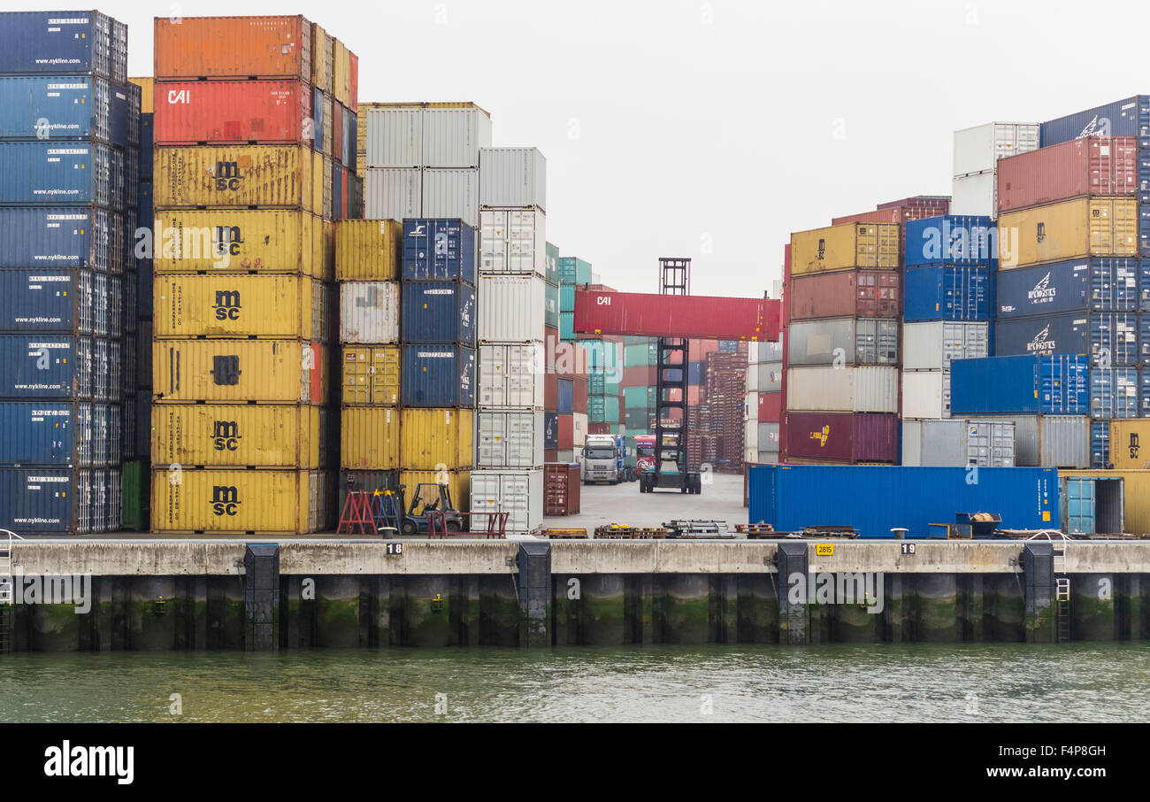 A forklift is moving containers on a cloudy day at Rotterdam Europort, Europe's largest
