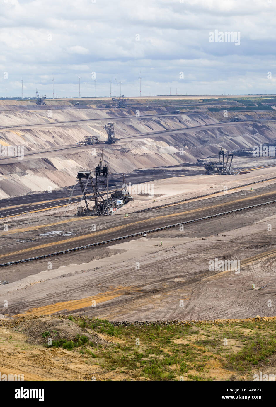 Bucketwheel excavators in the cratered landscape of the surface mining