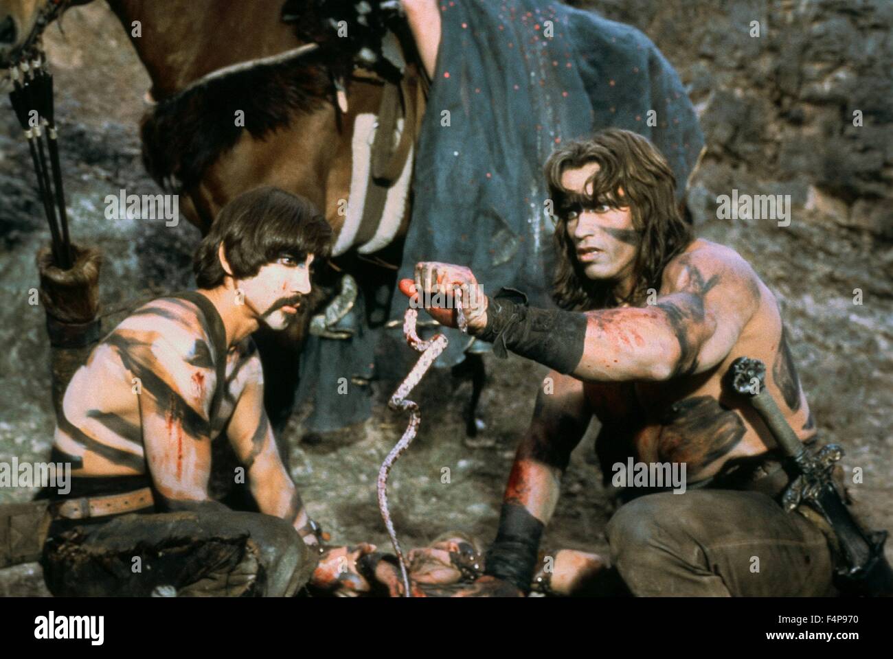 Arnold Schwarzenegger, Gerry Lopez / Conan the Barbarian 1982 directed by John Milius Stock Photo