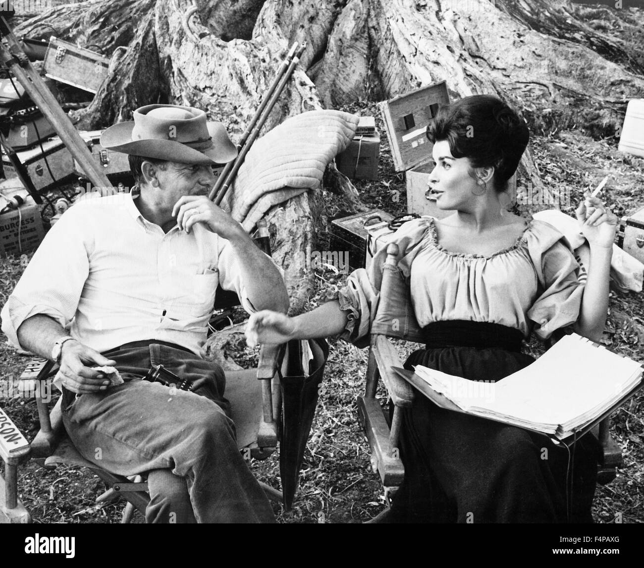 On the set Sam Peckinpah with Senta Berger / Major Dundee 1965 directed by Sam Peckinpah Stock Photo