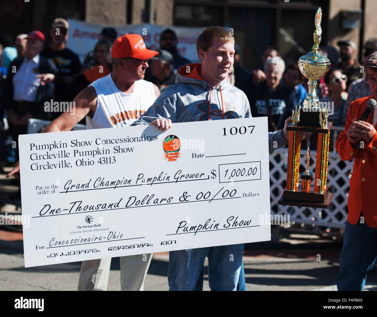 Circleville, Ohio, USA. 21st Oct, 2015. Rusty Ortman displays his first place trophy and his $1000 check at the 109th Annual Circleville Pumpkin Show in Circleville, Ohio. Credit:  Brent Clark/Alamy Live News Stock Photo