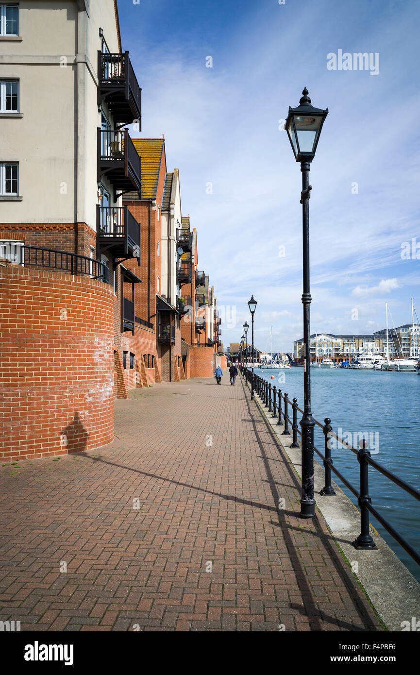 Pedestrian walkway along the quayside of Eastbourne Marina UK Stock Photo
