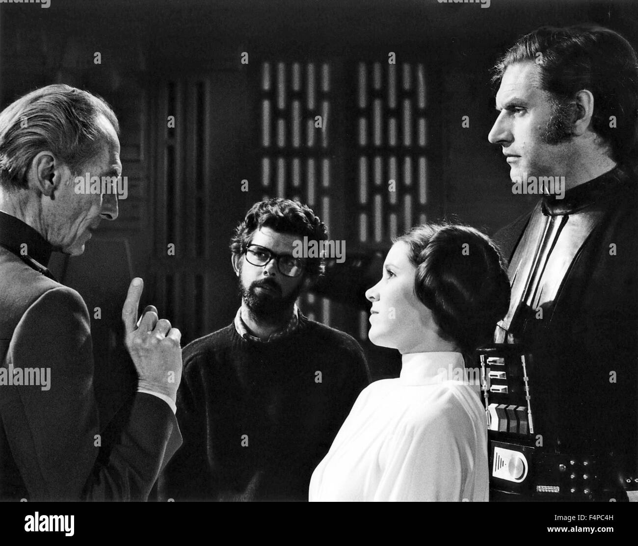 George lucas, Peter Cushing, Carrie Fisher, David Prowse / Star Wars - A New Hope 1977 directed by George Lucas Stock Photo