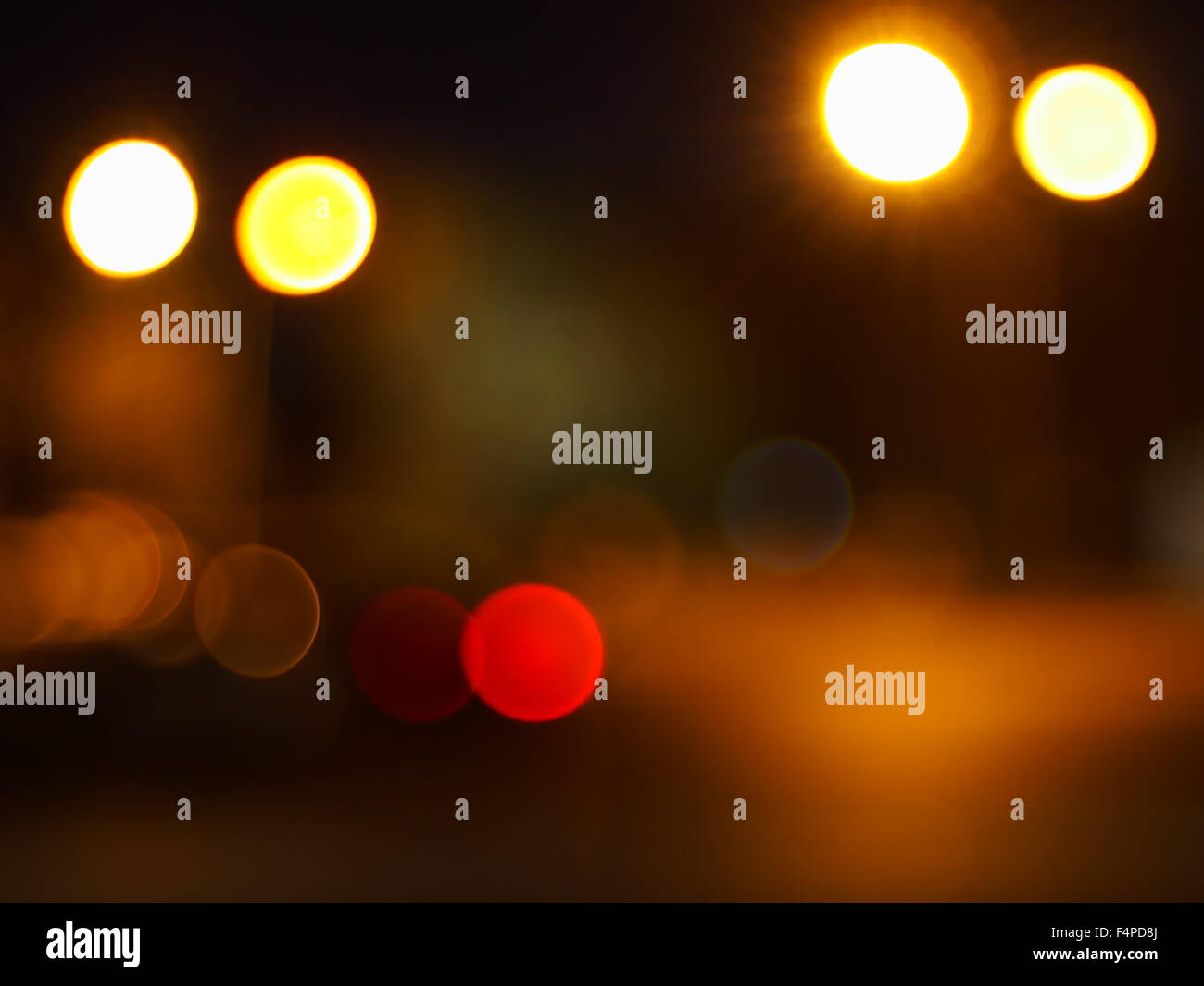 Abstract blur image of round spots of bright multicolored lights on ...