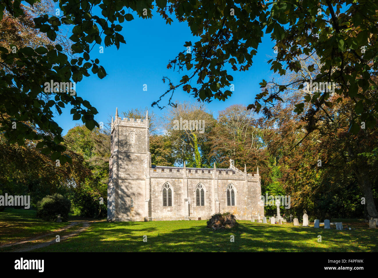 Autumn colour surrounds the Church of the Holy Trinity at Fleet in Dorset, UK near Weymouth Stock Photo